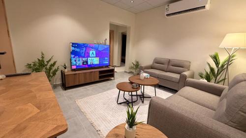 Unaizah Apartment | هوزان للإقامة b12 - شقة بدخؤل ذاتي غرفتين نوم وصاله معيشة
