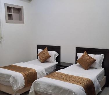 Quai Apartment | أرض الذهب للشقق المخدومة الرويضة