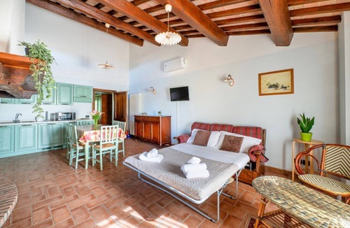 San Martino in Campo Apartment | A cozy 65 sq m apartment, located on the first floor of a building without an elevator, can accommodate up to 4 people.The property is located within a characteristic Umbrian-Tuscan farmhouse, featuring a large garden, relaxation areas, and a shared swim