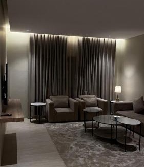 As Salam Apartment | A suite with a room and a lounge with a quiet and modern design