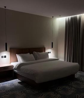 As Salam Apartment | A suite with a room and a lounge with a quiet and modern design