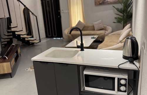 Riyadh Apartment | Chic 1-bedroom apartment with WiFi, AC in vibrant Riyadh-T