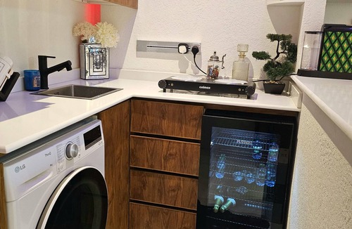 Riyadh Apartment | Chic 1-bedroom living room kitchen small garden. with WiFi, AC in Riyadh
