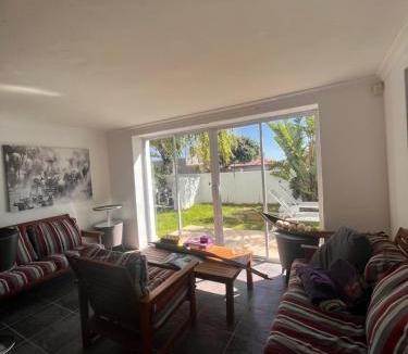 Camps Bay Ski Chalet | Cozy Camps Bay House with mountain and sea view