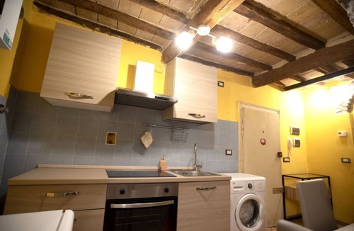 Old Town Apartment | Cozy suite in the heart of Perugia, perfect for 2 guests.Elegant room, comfortable living room and kitchen equipped to feel right at home.The unique detail? The natural stone walls, which give charm and character to the environment.Bright and well-kept,