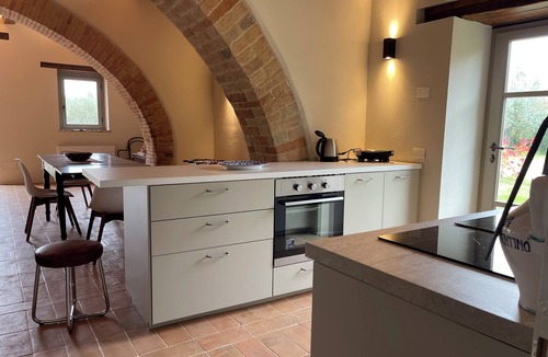 Marsciano Apartment | Deluxe Cypress Suite: vaulted living room and pool
