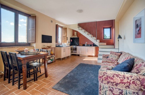 Fratticiola Selvatica Apartment | GuestHost - Elegant 87 sqm apartment in a renovated farmhouse, nestled in the Umbrian countryside. Ideal for 4 people, it offers a shared saltwater pool and an uncovered parking space. Perfect for those seeking relaxation and tranquility, surrounded by b