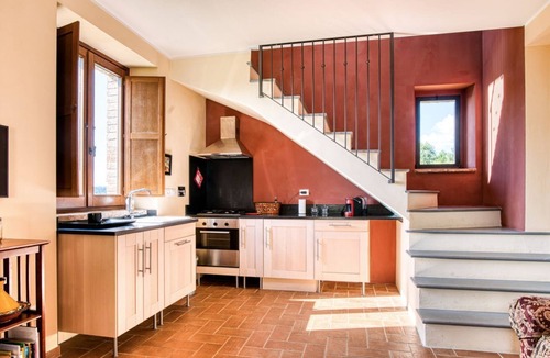 Fratticiola Selvatica Apartment | GuestHost - Elegant 87 sqm apartment in a renovated farmhouse, nestled in the Umbrian countryside. Ideal for 4 people, it offers a shared saltwater pool and an uncovered parking space. Perfect for those seeking relaxation and tranquility, surrounded by b