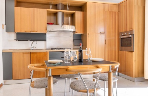 Ponte San Giovanni Apartment | GuestHost - Bright 80 sqm apartment that can accommodate up to 6 people, located near the Ponte San Giovanni station. It consists of a living room with kitchen and dining area, a bathroom and two bedrooms. The flat is located on the ninth floor and has a