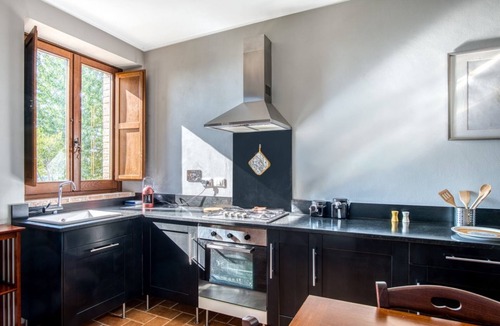 Fratticiola Selvatica Apartment | GuestHost - Elegant 57 sqm apartment in a renovated farmhouse, nestled in the Umbrian countryside. Ideal for 3 people, it offers a shared saltwater pool and an uncovered parking space. Perfect for those seeking relaxation and tranquility, surrounded by b