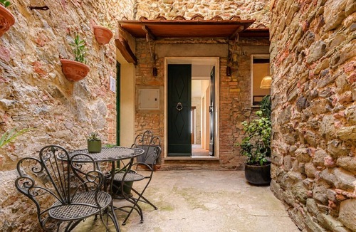 Scrofiano Apartment | Panoramic Views in the Heart of Tuscany, Historic Borgo Apartment with balcony.