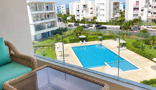 Beachfront Apartment in Sidi Rahal | Pool & Parking, Ocean View, Blue View
