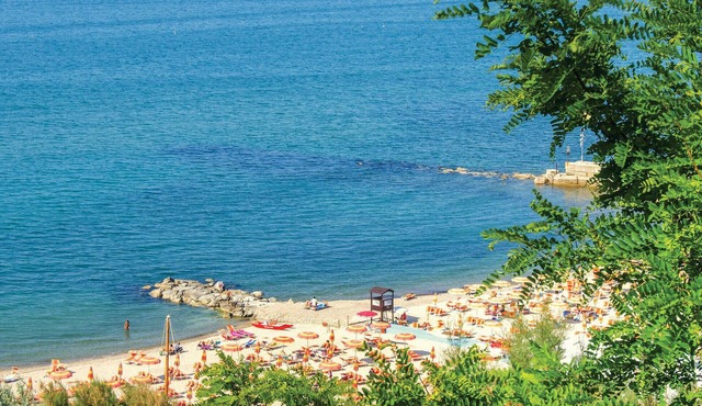 Spacious villa with large veranda and near the beach.