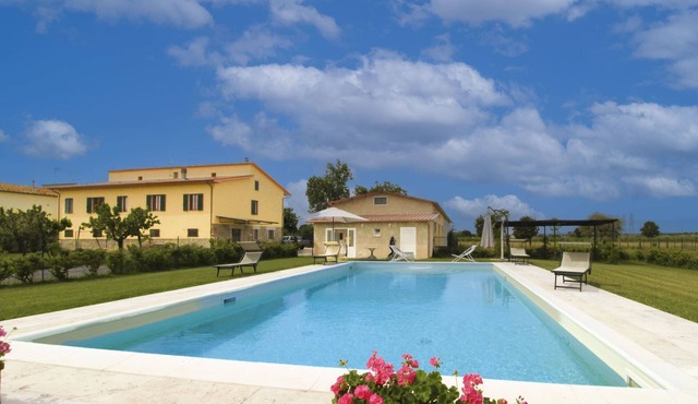 Typical Tuscan house with private and fenced swimming pool. View on the village of Castiglion Fioren