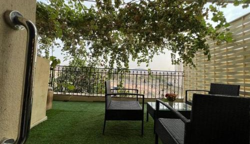 Four-Bedroom Apartment with Balcony 