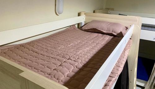 Single Bed in Dormitory Room