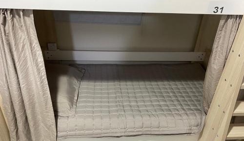 Single Bed in Dormitory Room