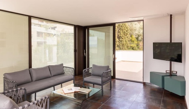 GuestHost - Wonderful apartment that accommodates up to 4 people, on two levels and equipped with all comforts, including a large terrace overlooking the city and the hills. The accommodation is located in a modern condominium complex with a shared swimm
